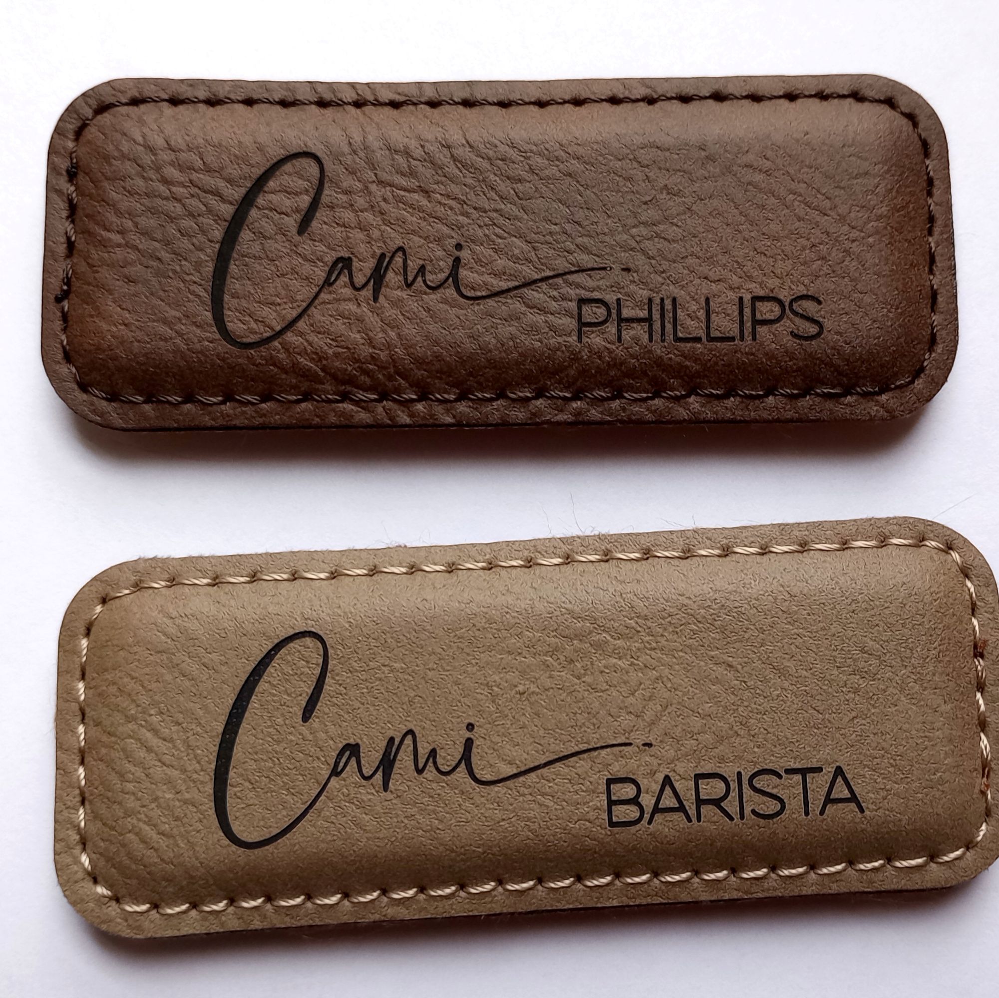 Two personalized leatherette barista name badges in shades of coffee.