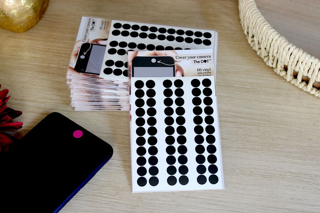 Cover your camera with The DOT™, now available to sell in retail stores. This image shows the front of the retail packaging.